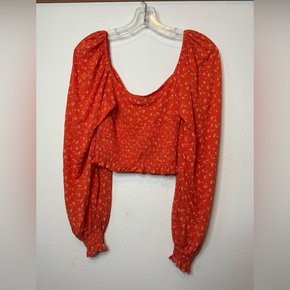 Urban outfitters, US size small, long sleeve red top with small floral print.